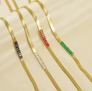Detail of 18K gold-plated snake chains with colorful rectangular zircon gemstones