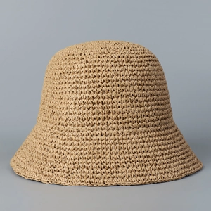 Close-up of handwoven straw sun hat texture featuring high-density crochet bucket design