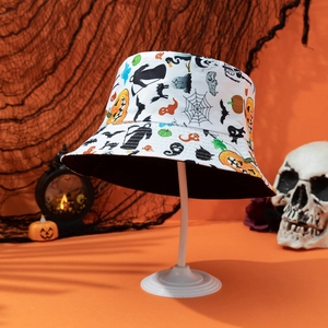 Close-up of Halloween bucket hat with pumpkin and ghost prints on orange background