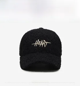 Detailed front view of black sherpa baseball cap with HEＡRT 3D embroidery detail