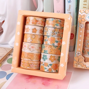 Detail view of 12-roll cherry blossom washi tape set with gold foil floral patterns