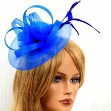 Detail of blue mesh fascinator hat with elegant feathers for bridal tea parties