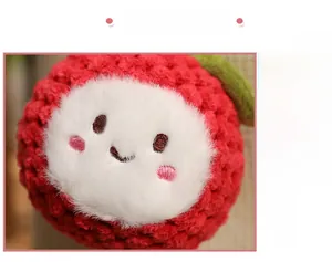 Macro detail of handmade crochet lychee plush pendant with cute embroidered facial features