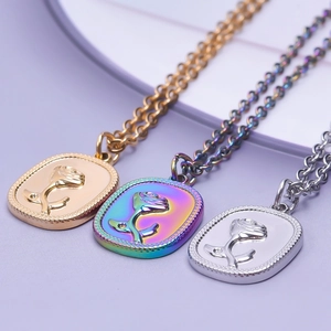 Three vintage rose relief pendants in gold, rainbow, and silver on 50cm stainless steel necklaces