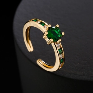 Luxurious 18K gold plated copper ring with green zircon and side stone accents