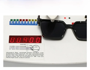 Black square sunglasses undergoing professional UV400 ultraviolet protection testing