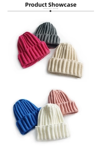 Macro detail of ribbed knit beanie hats in multiple colors showing texture and fabric