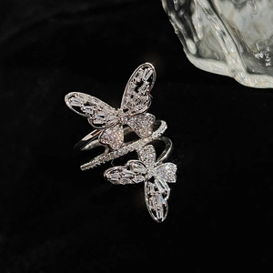 Macro shot of silver-tone double butterfly ring with pave cubic zirconia stones