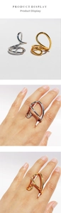 Detailed product display showing gold and silver geometric irregular polished metal rings