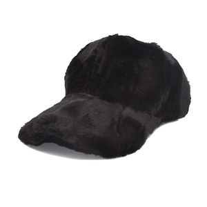 Detail of solid black faux rabbit fur texture on a warm winter baseball cap