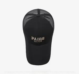 Top view of black trucker hat featuring golden 3D embroidery and breathable mesh back