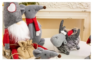 Detailed close-up of festive Christmas gnomes and animals made of felt and faux fur