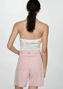Back view of a backless halter top and striped high-waisted shorts for summer