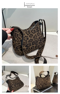 Detail of leopard print faux suede fabric and adjustable black strap on crescent bag