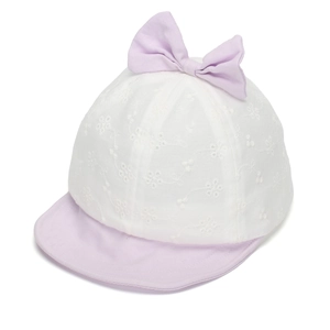 Detail of white embroidered sun hat for baby girls featuring a lavender bow decoration