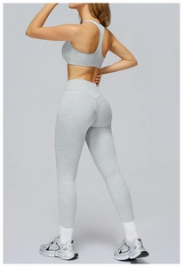Detail of grey racerback yoga bra and high waist leggings with seamless stitching