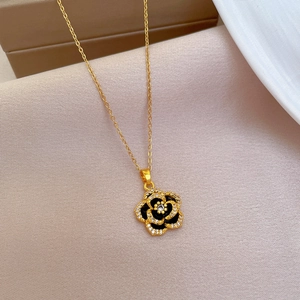 Titanium steel gold necklace featuring a black camellia flower pendant with micro-inlaid diamonds
