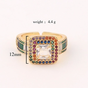 Close-up of gold ring with emerald zircon and weight 4.4g and 12mm size markers