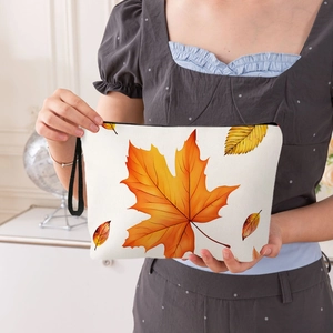 Autumn Thanksgiving makeup bag featuring realistic maple leaf print and a black wrist strap
