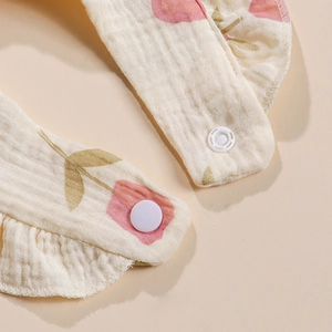 Detailed macro view of soft muslin cotton fabric with ruffle edges and tulip print