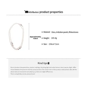 Detail showing 158cm long pearl necklace with silver rhinestone balls and glossy finish