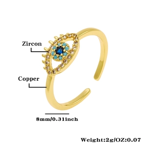 Macro detail of adjustable evil eye ring with blue zircon inlay in 18K gold plated copper