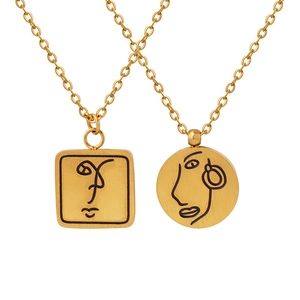 Collier en acier inoxydable doré avec pendentifs minimalistes d'art de visage
