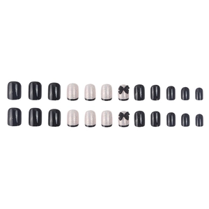 Faux ongles noirs à presser avec dégradé pailleté et nœuds décoratifs élégants