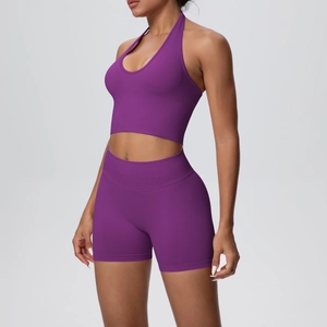 Detail view of purple ribbed knit yoga set featuring a halter bra and high-waist shorts