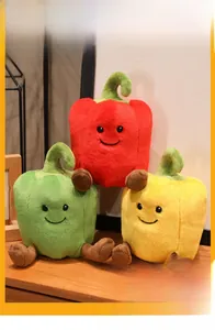 Close-up of three cute plush bell pepper dolls in red, yellow and green colors