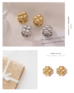Macro detail of gold and silver four-leaf clover earrings with premium gift box packaging