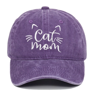 Close-up of Cat Mom white embroidery on vintage washed purple cotton baseball cap