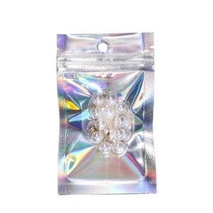 Detailed holographic laser bag featuring a pearl necklace with golden chain and seal