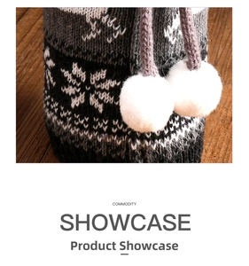 Detail of knitted wine bottle cover with Nordic snowflake pattern and white pom poms