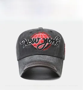 Detailed embroidery of New York text on dark gray washed cotton baseball cap with leather brim