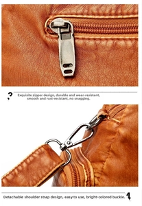 Detail of lychee pattern leather texture with silver zipper and detachable swivel hook strap