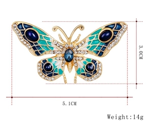 Detailed view of enamel butterfly brooch with size dimensions 5.1cm and 3.0cm
