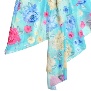 Macro view of light mesh fabric with vintage blue floral prints on a slim fishtail dress
