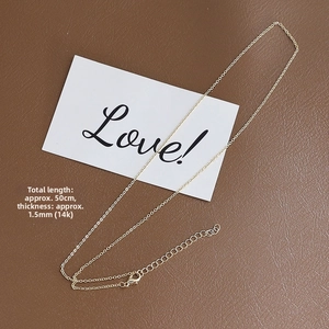 Detailed view of 1.5mm thin 14k gold-plated flat O-chain with adjustable lobster clasp
