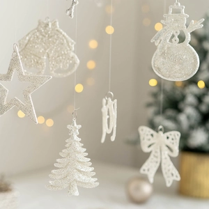 White glitter Christmas tree ornaments set including stars, snowman, and JOY sign