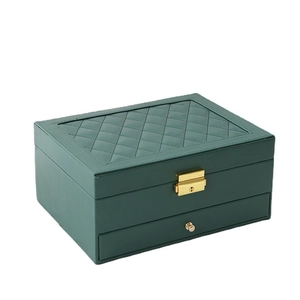 Double-layer dark green leather jewelry box with quilted pattern and gold lock