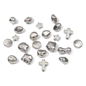 Silver CCB star cross and pebble beads for DIY jewelry making on white background