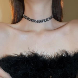 Close-up of elegant black full diamond choker necklace worn on model neck for luxury style