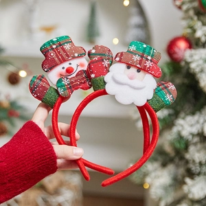 Festive Christmas headbands featuring Santa and Snowman designs for holiday parties