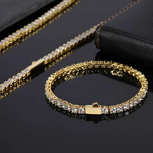 Detail of gold tennis chain set featuring round white zircons and a secure plug-in clasp