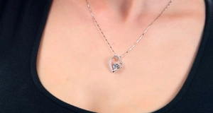 Close-up of S925 sterling silver heart pendant necklace with a sparkling zircon inlay