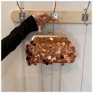 Detailed close-up of gold sequin crossbody bag with luxury metallic chain and clasp