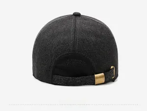 Detail view of the adjustable metal buckle and thick wool fabric on a men's winter cap