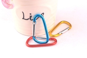 Close-up of colorful D-ring aluminum alloy carabiners in blue, red, and yellow finish