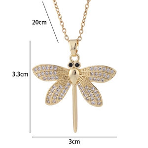 Detailed view of dragonfly pendant dimensions 3.3x3cm with white zircon inlay on gold chain